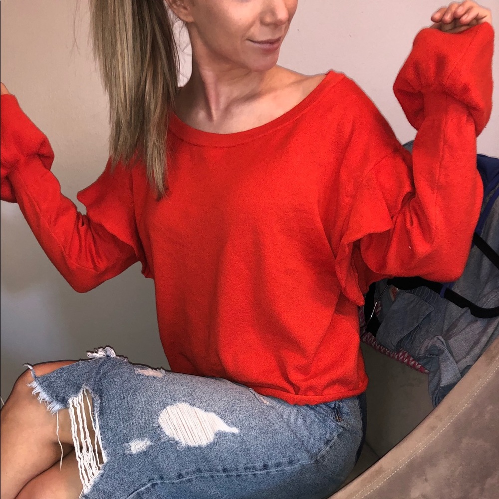 Cute bright orange sweater with ruffle